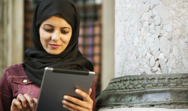 student checking tablet